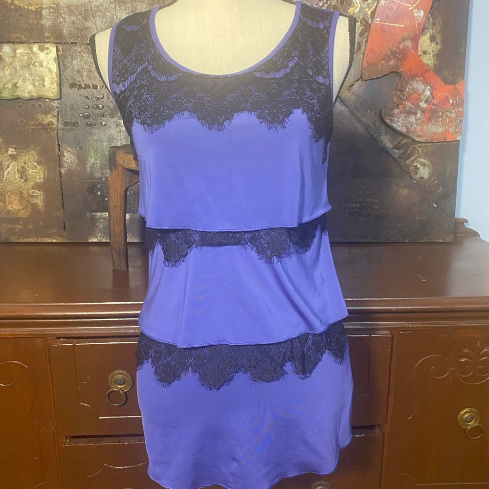 Maurices sleeveless top with keyhole back and lace detail.